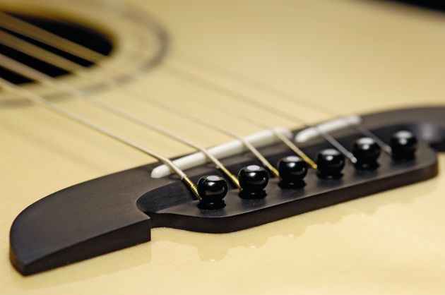 The handlebar moustache-shaped ebony bridge is a distinctive touch